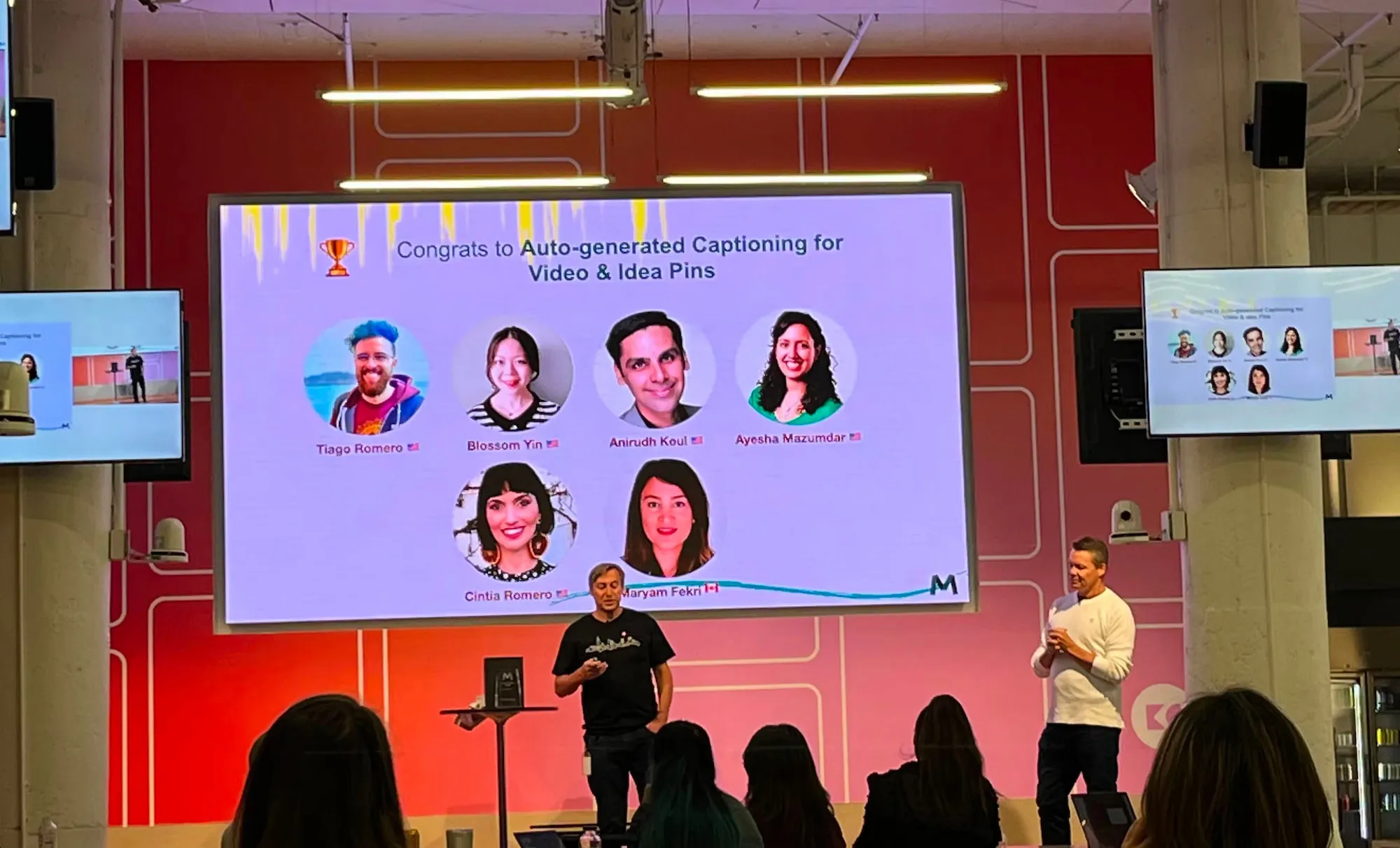 Makeathon winner announcement, showing Cintia's project and teammates on the screen.